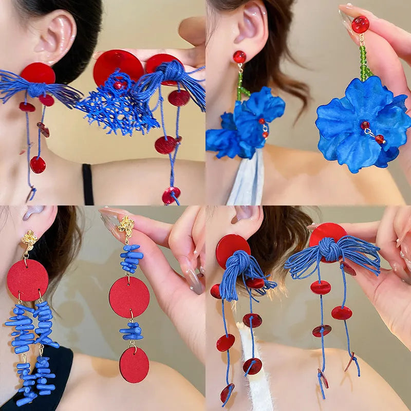 Women's geometric earrings with cloth base and silver needle-blue resin flower accents