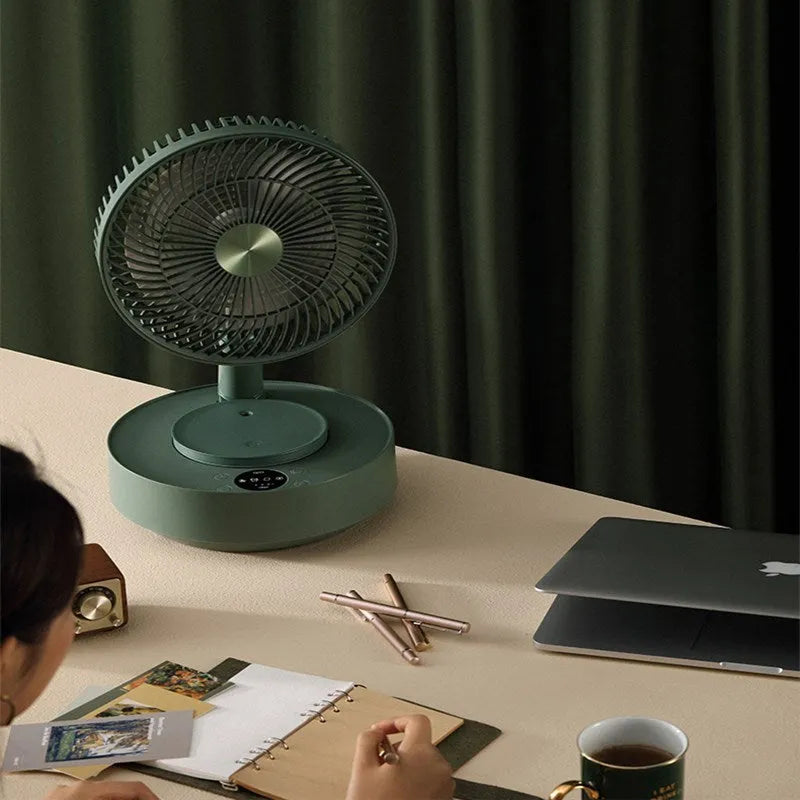 Green telescopic floor fan extended to vertical position with remote control