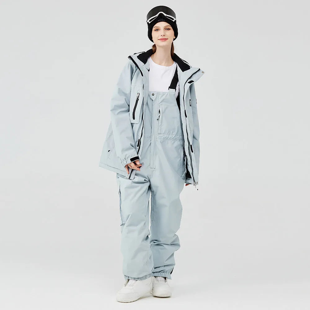 Men's and women's waterproof ski suit in blue with black trousers for winter snow sports