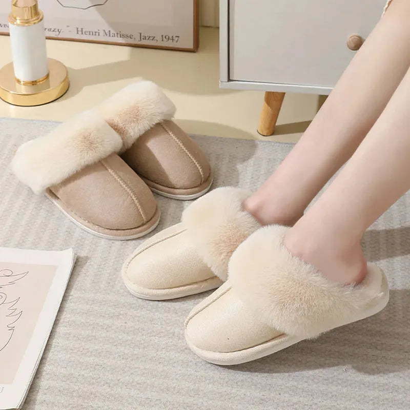 Women's plush-lined indoor slippers with round toe and flat heel in a choice of colours.