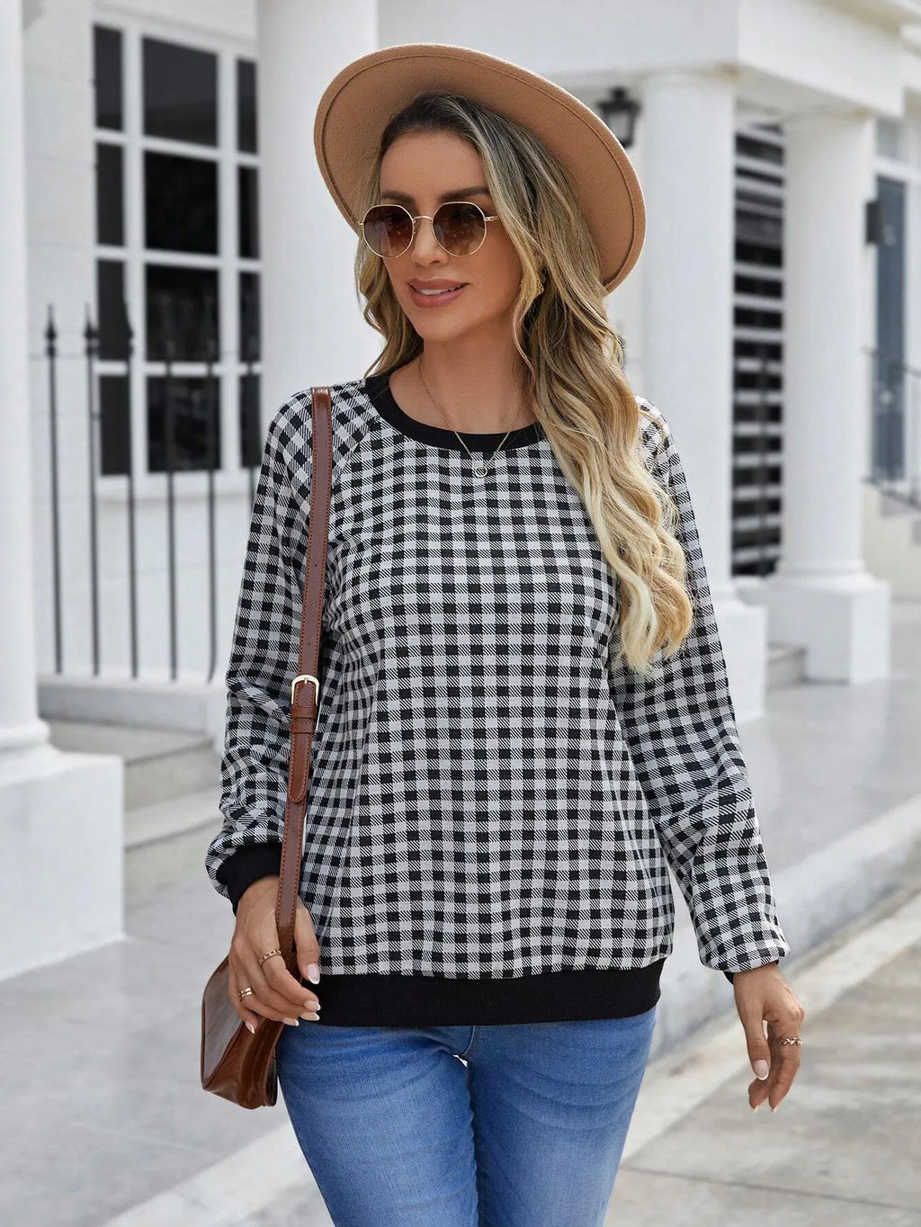 Black plaid pullover sweater with long sleeves and Japanese-inspired printed pattern