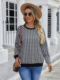 Black plaid pullover sweater with long sleeves and Japanese-inspired printed pattern