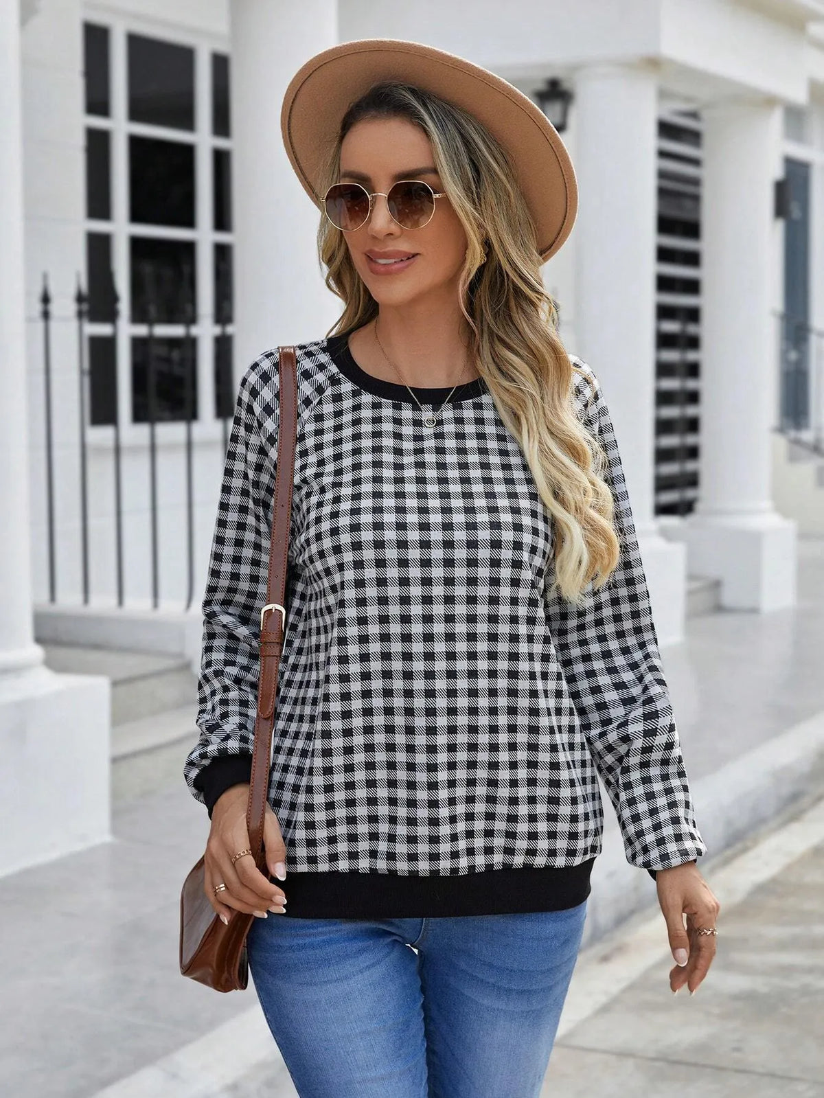 Black plaid pullover sweater with long sleeves and Japanese-inspired printed pattern