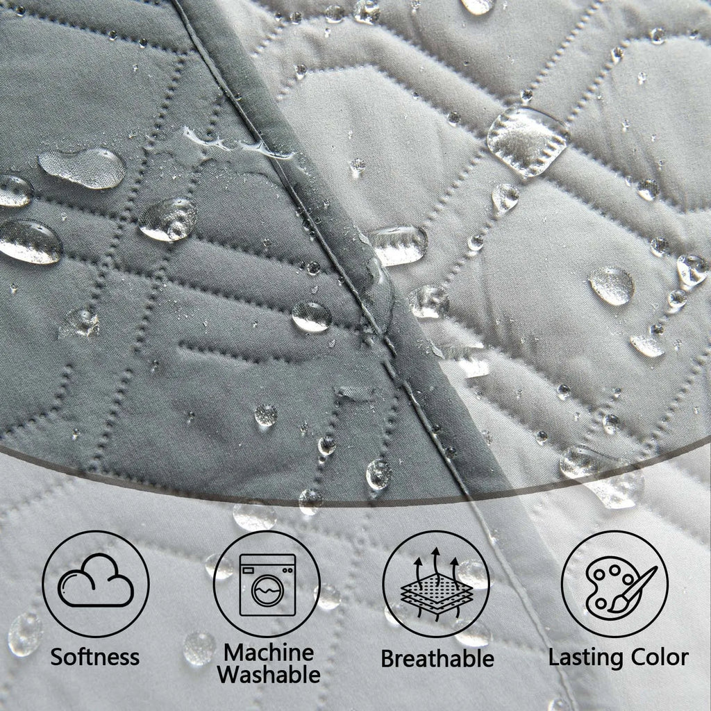 Double-sided waterproof dog sofa cushion in dark grey and light grey contrasting colours on a sofa.