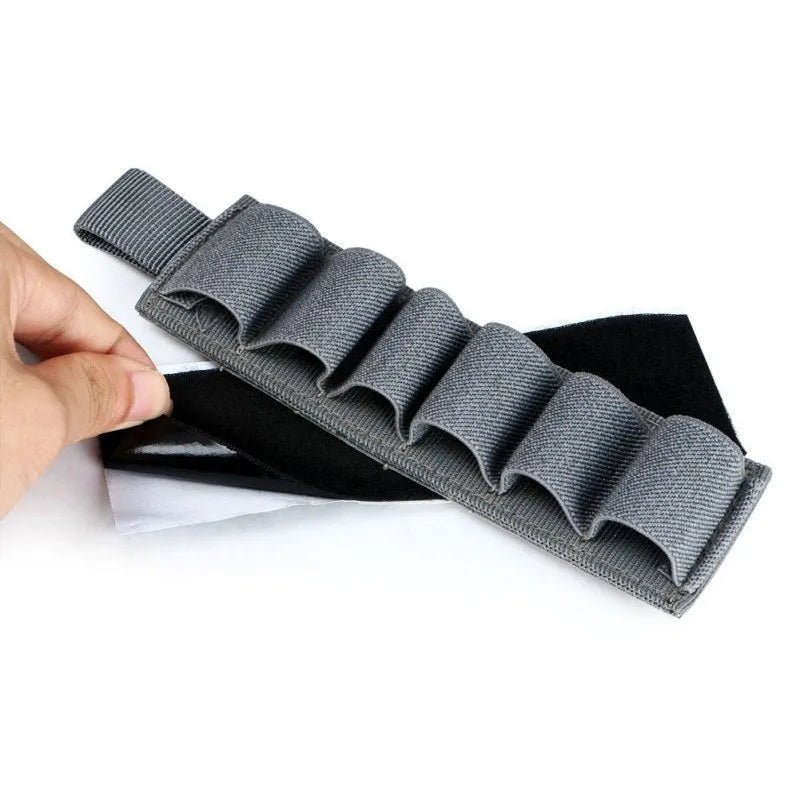Tactical 6-hole storage sticker in 1000D nylon, shown in army colour, measuring 5 by 16.5 centimetres.