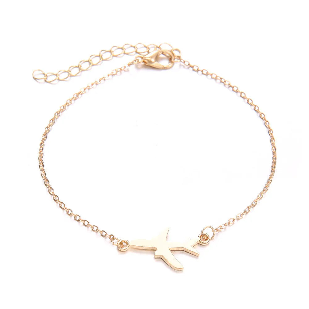 Three Bohemian-style bracelets with heart-shaped alloy charms featuring aircraft map designs