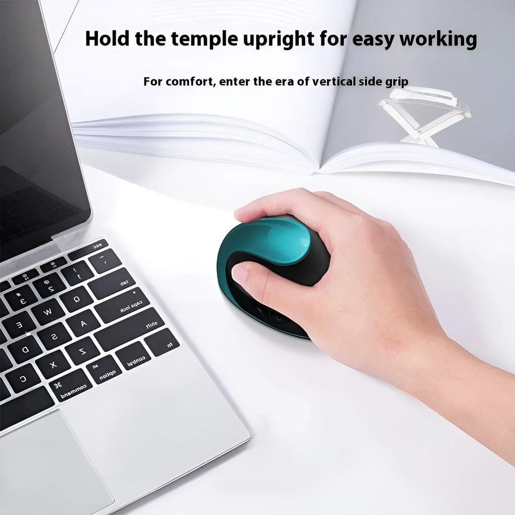 Wireless vertical ergonomic mouse in red colour on a desk next to a laptop.