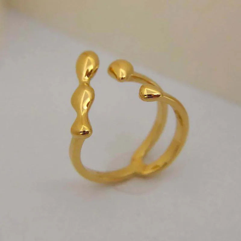 Brass opening ring with sphere circle detail in gold colour, adjustable women's fashion jewellery