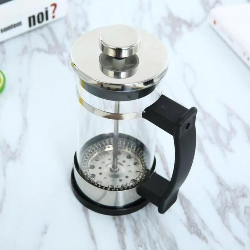 Glass French press coffee maker with stainless steel plunger showing 350ml capacity markings