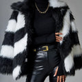 Women's beige faux fur lapel coat with a dark contrast fur collar on a hanger.