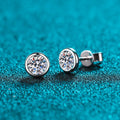 A pair of geometric Pt950 gold-plated 925 silver stud earrings for women with a moissanite centre stone.