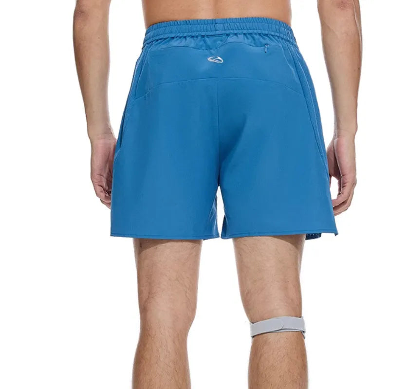 Men's black four-point running shorts with laser stitching on a flat surface, showing stretch fabric.