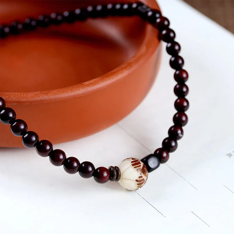 Natural rosewood double-ring bracelet with 10mm floral beads in hand-knitted construction
