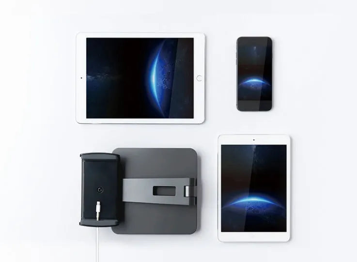 Foldable aluminium desktop phone and tablet holder in silver showing 360-degree rotation
