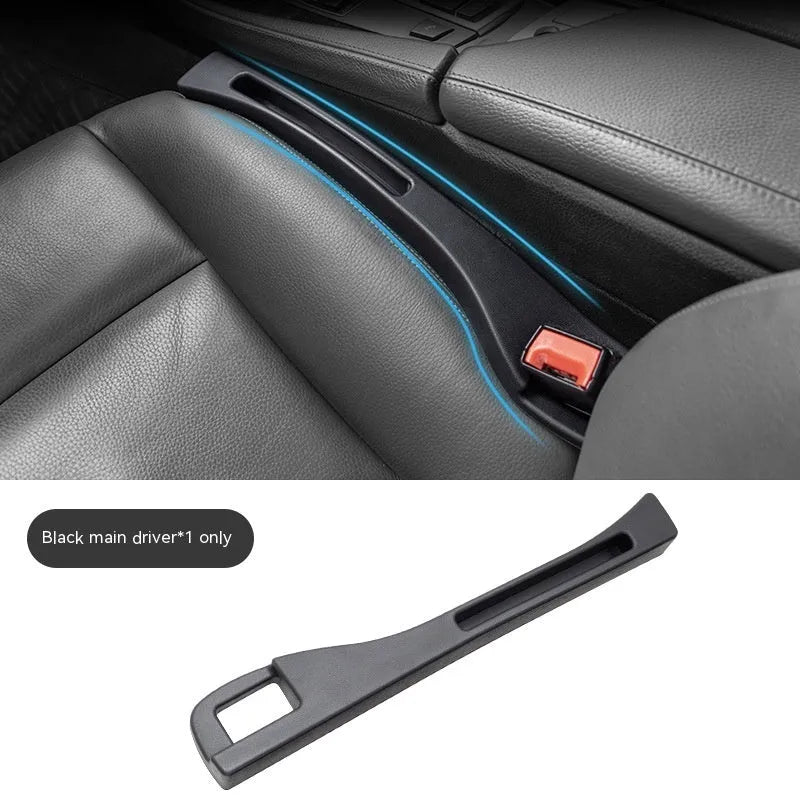 Black plastic car seat gap storage box with handle between vehicle seats