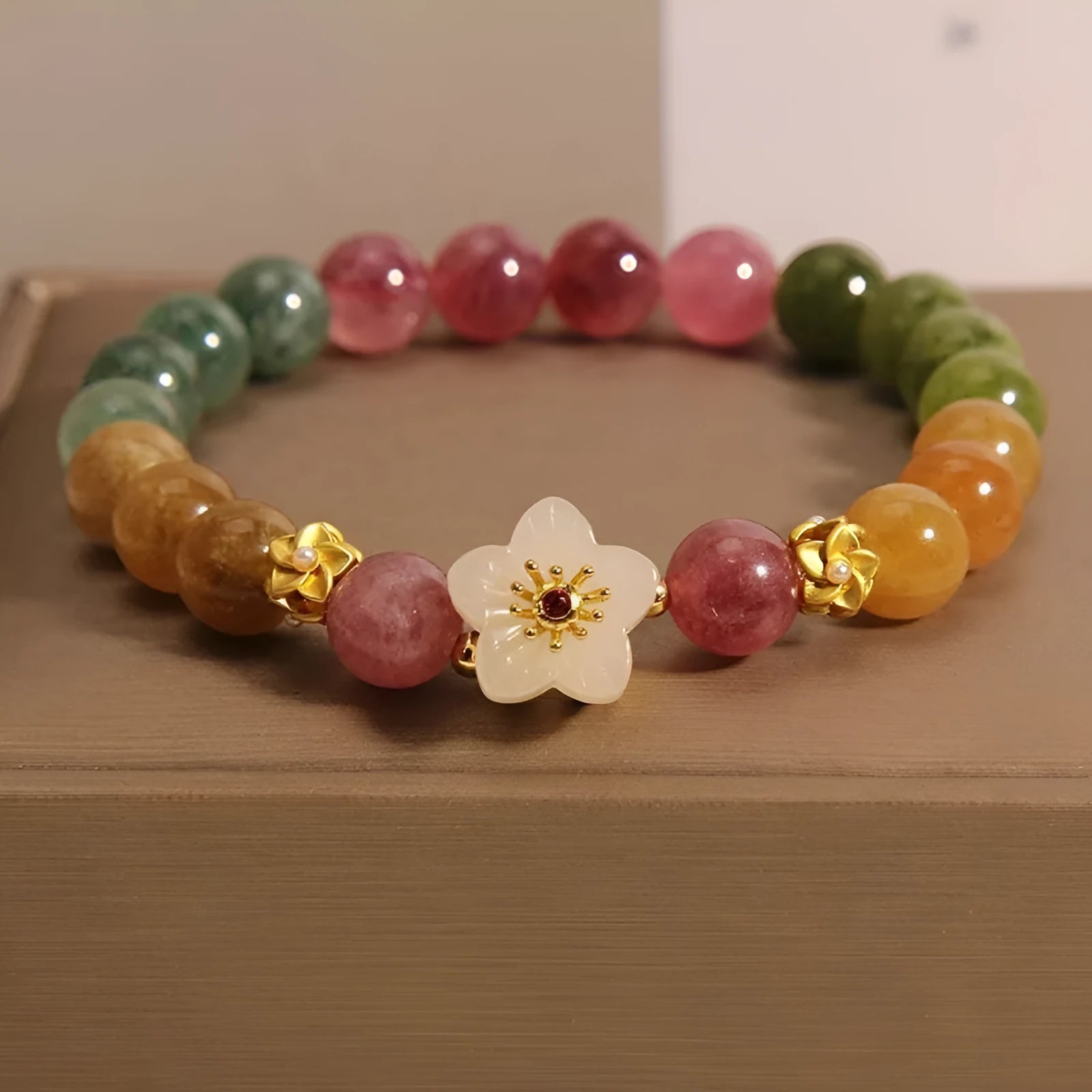 Tourmaline bracelet with natural stones in floral design and electroplated geometric setting