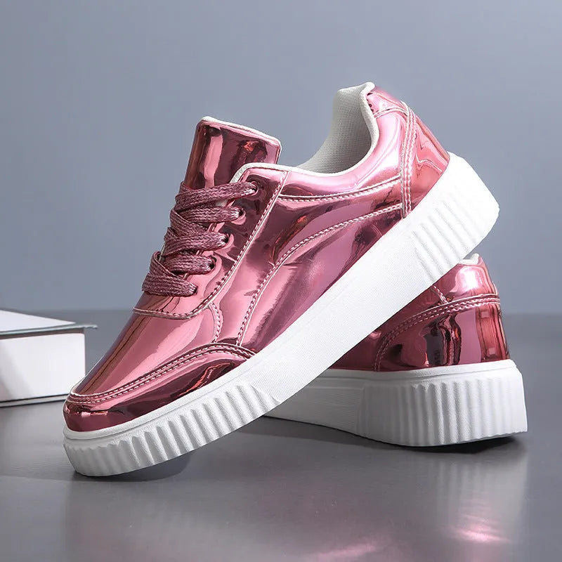 Gold platform sneaker with sequin upper and thick MD sole on a white background.