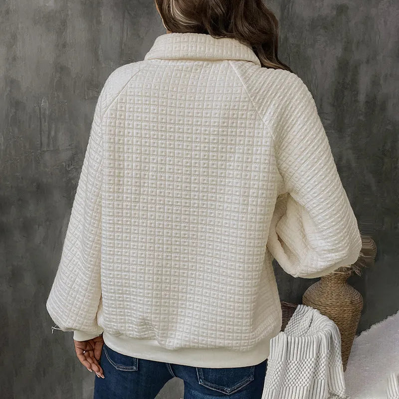 Women's milky white polo collar sweater with long sleeves and textured knit.