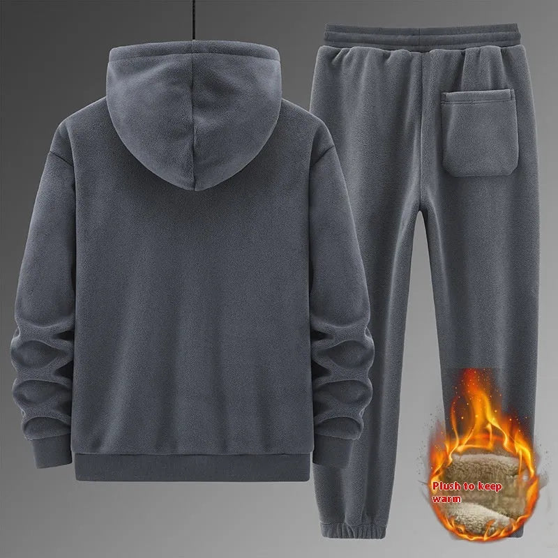 Casual sports suit consisting of a grey cashmere hooded sweater and matching cotton trousers.
