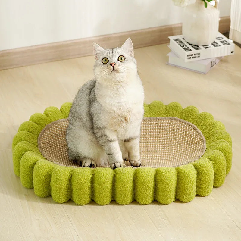 Green oval cat scratcher bed with sisal surface, showing bowl shape for scratching and sleeping