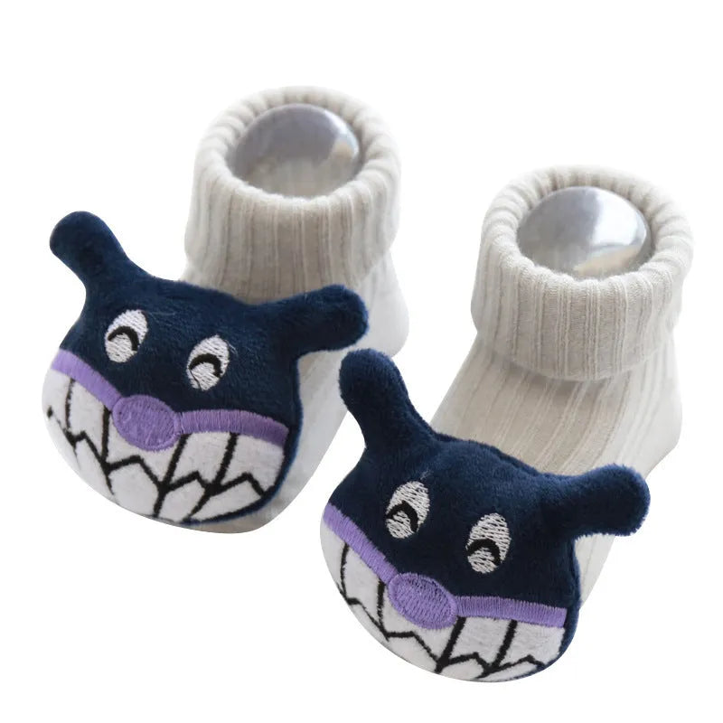Cotton baby floor socks in a selection of colours and patterns like panda, lion, and bows, shown in sizes for infants.