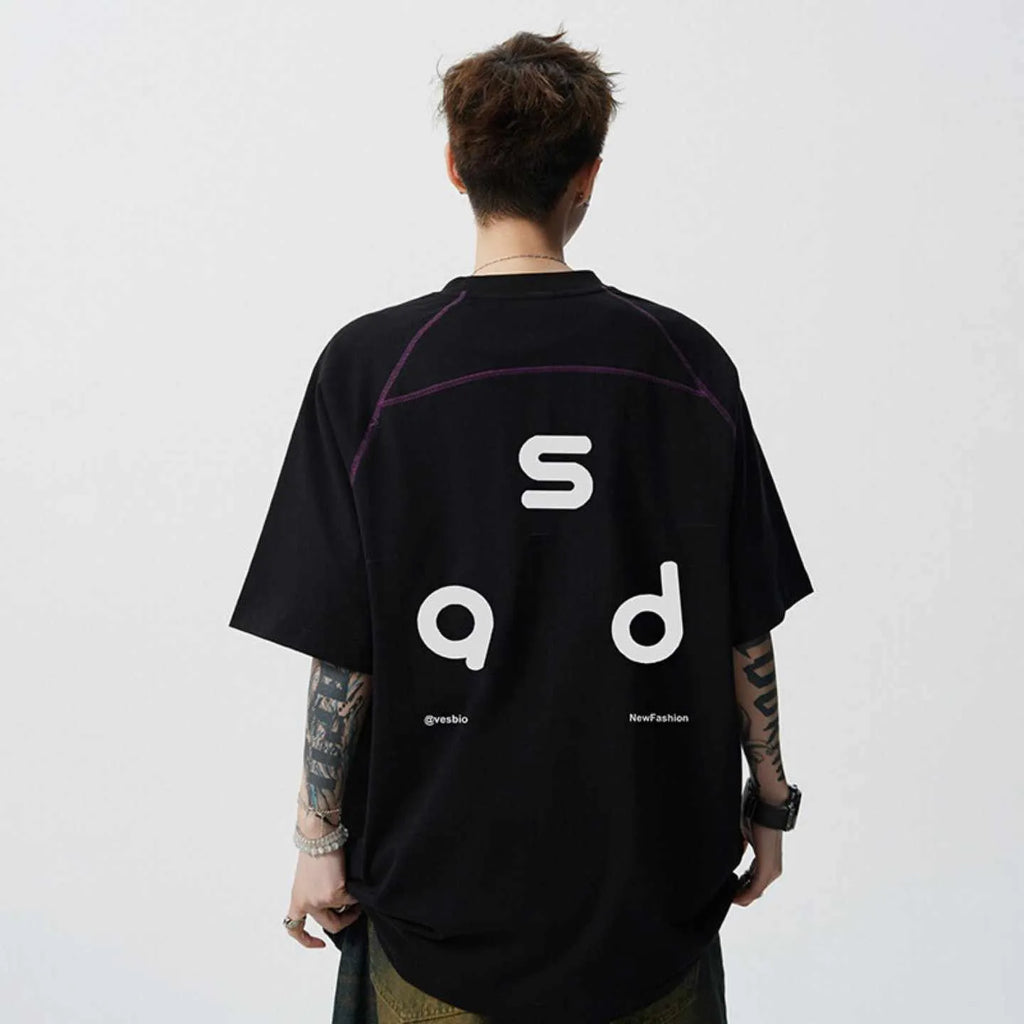 Loose-fit black cotton short-sleeve t-shirt with white letter print graphic on a mannequin.