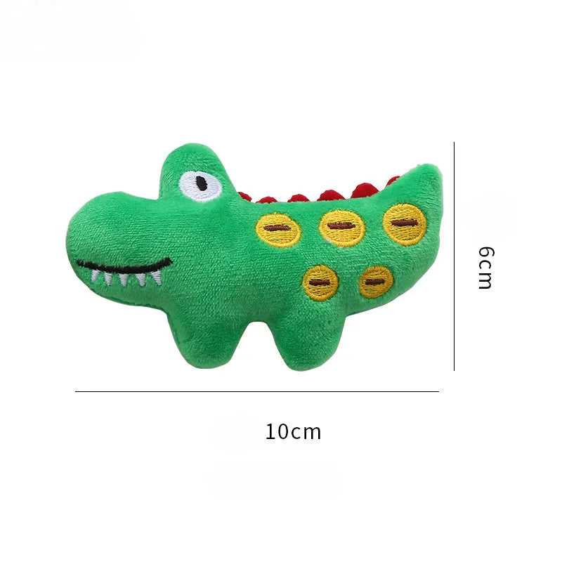Plush cat toy in shape of a cow, a crocodile, and a parrot on a plain background.