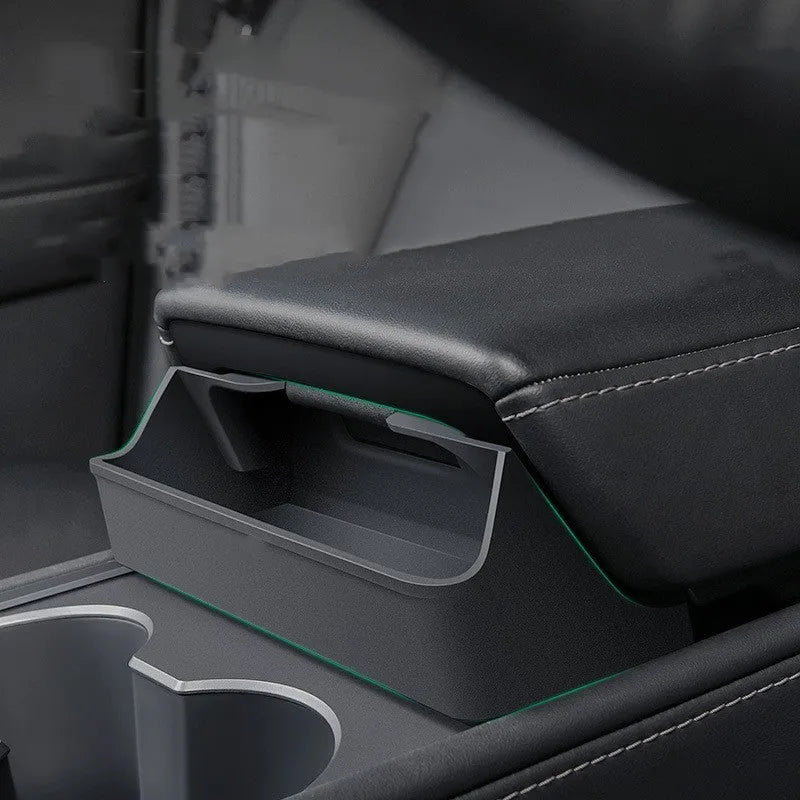 Black silicone glasses storage case mounted inside a Tesla Model 3/Y centre armrest console.