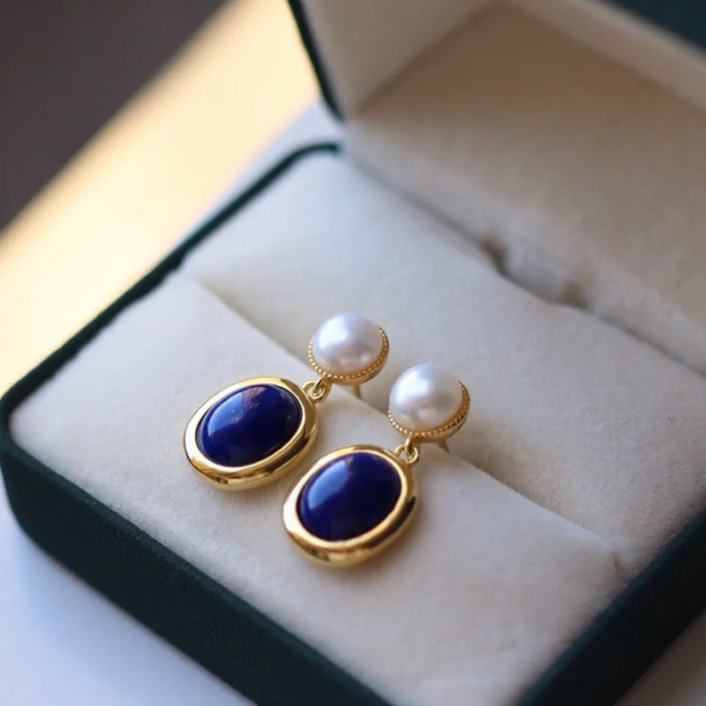 Simple drop earrings with a blue Lapis Lazuli pearl set in sterling silver, featuring auspicious pattern details.