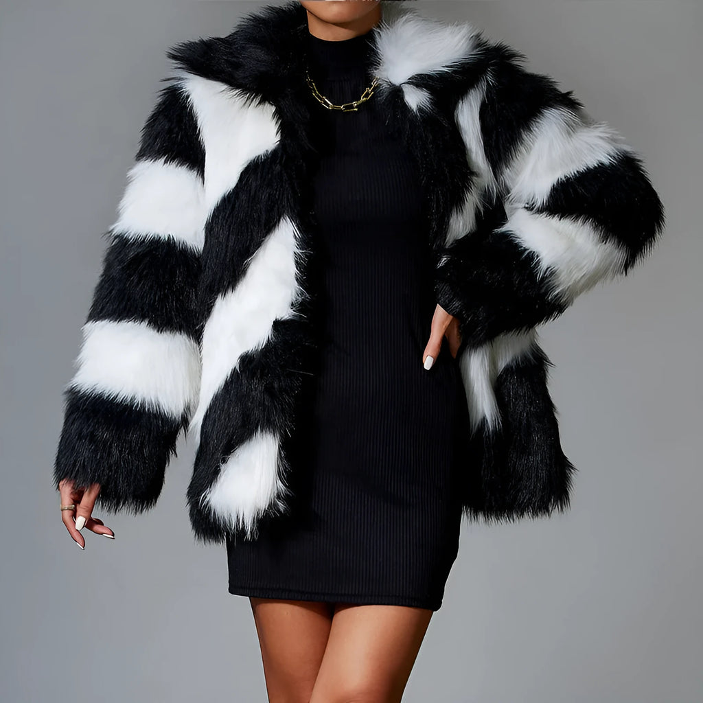 Women's beige faux fur lapel coat with a dark contrast fur collar on a hanger.