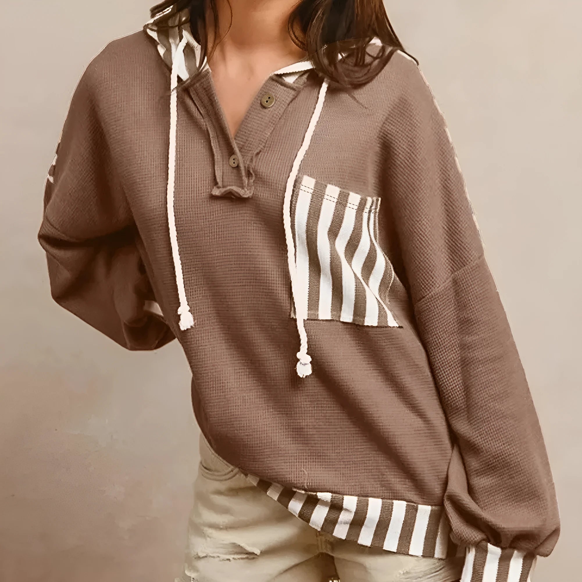 Straw yellow hoodie with waffle texture fabric and striped patchwork panels, button neck and drawstring waist