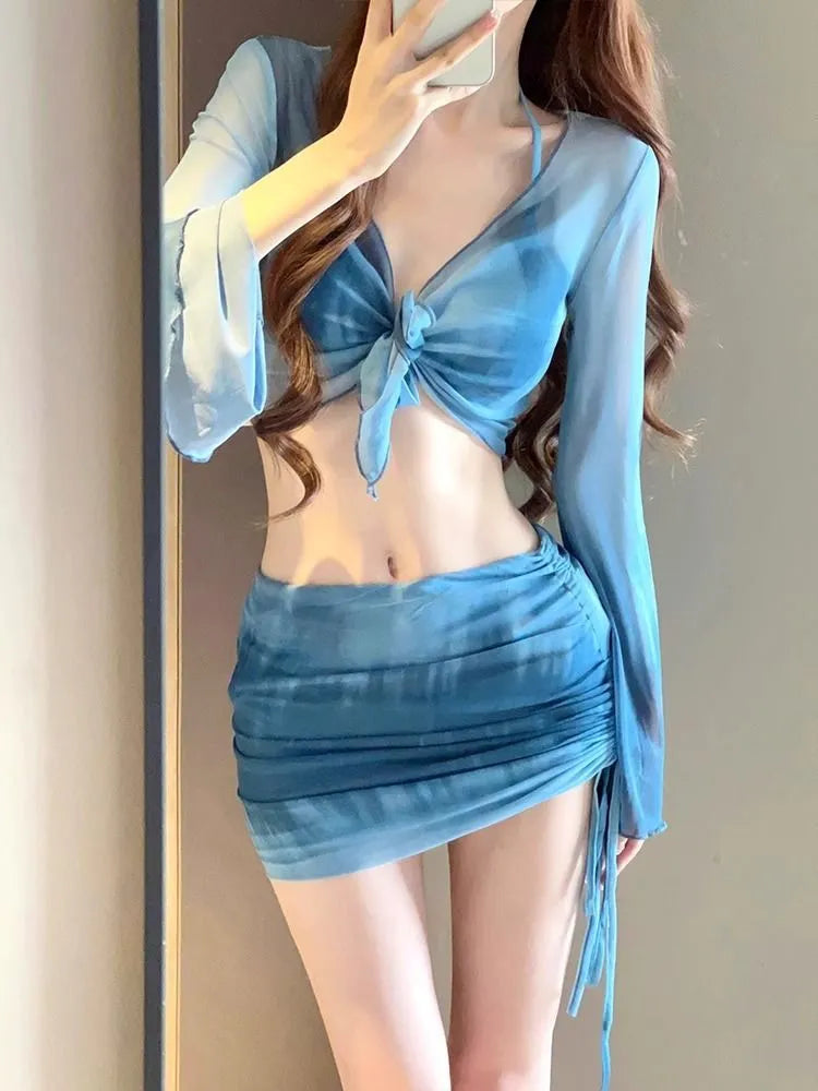 Women's blue four-piece bikini set with high-waist briefs and European-American styling
