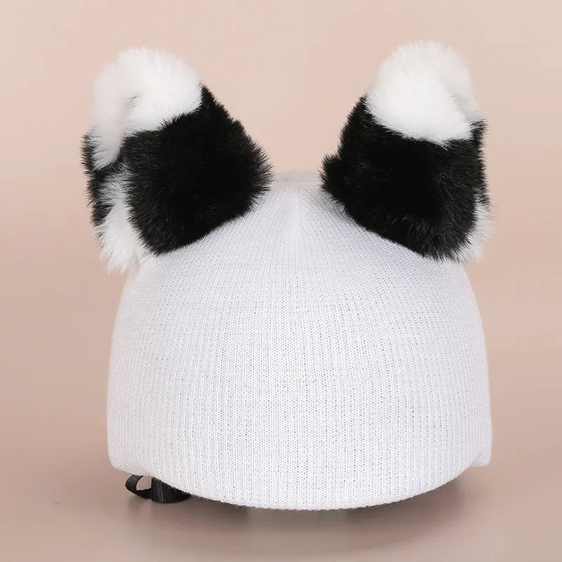 Cute cartoon plush decoration attached to a ski helmet