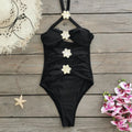Women's solid colour one-piece swimsuit with a matching removable short skirt in a high-waisted design.