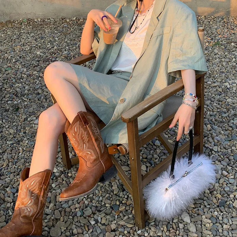 Brown women's embroidered Martin boots with leather lining, low square heel, and waterproof platform sole.