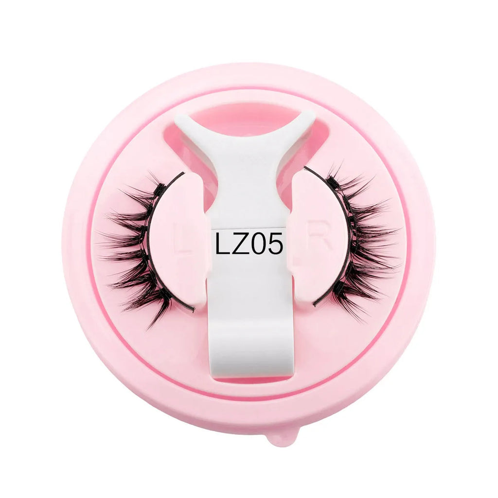 Set of reusable, glue-free false eyelashes in a natural thick style made from artificial fibre.
