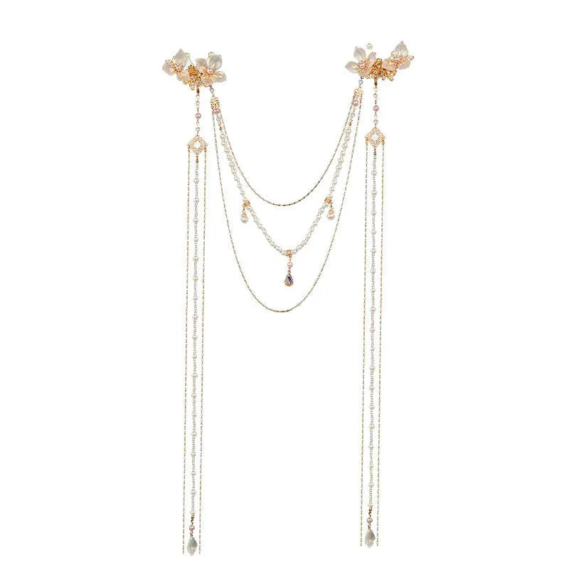 Gold-coloured women's hairpin with a pearl diamond flower decoration and a long acrylic tassel.