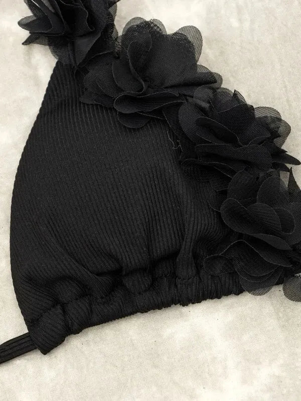Black women's swimwear two-piece set with gathered top and matching shorts