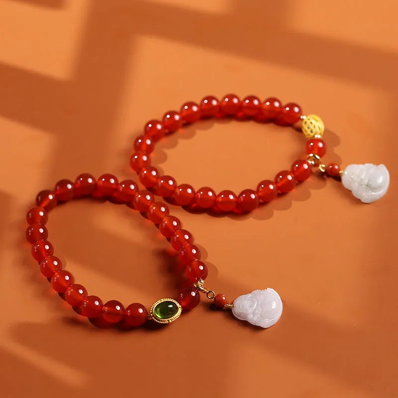Handmade red agate bracelet with geometric Chinese design featuring Maitreya Buddha jade pendant and ancient gold elements