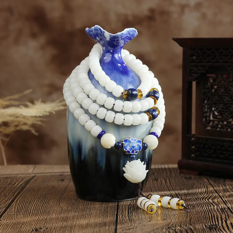 White jade Bodhi bead bracelet with 6x8mm beads in various decorative styles