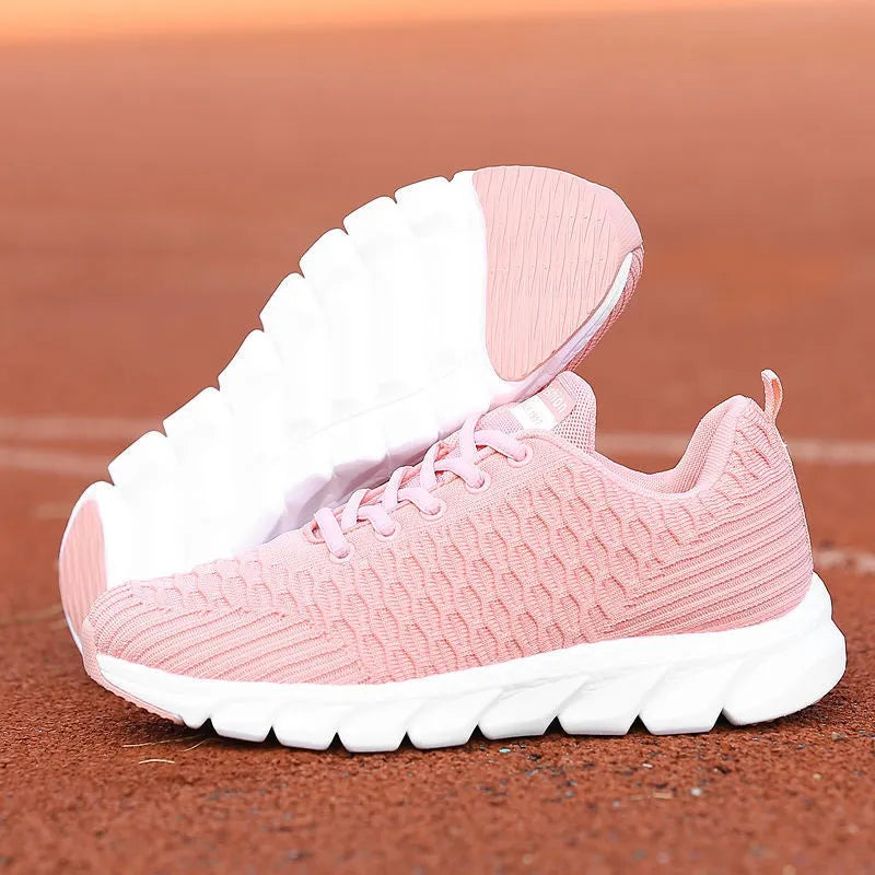 Women's running shoes with fly weaving upper in black, pink or white colours showing breathable construction