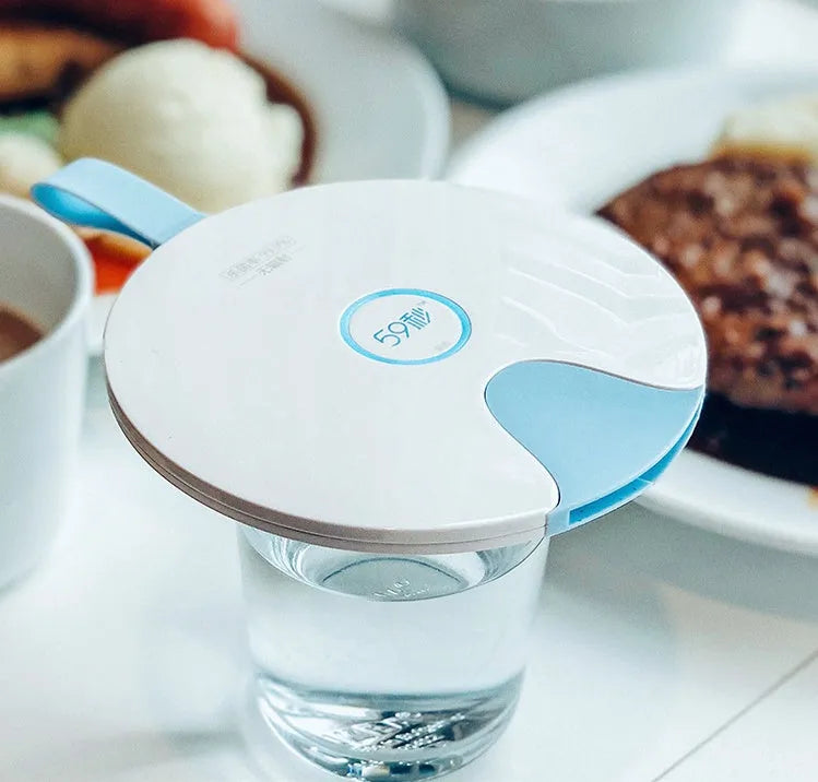 Portable UV-C baby bottle steriliser in blue with USB charging cable and compact travel size