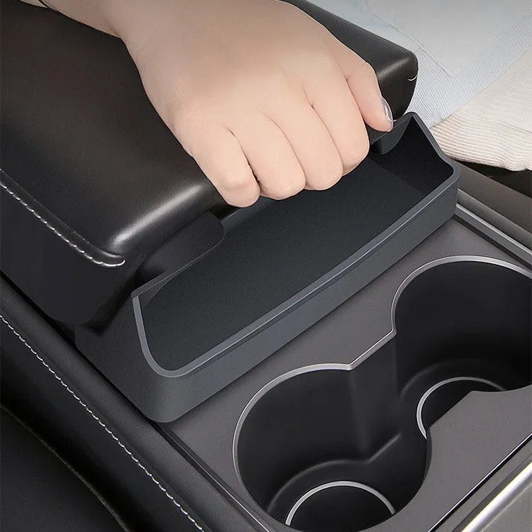Black silicone glasses storage case mounted inside a Tesla Model 3/Y centre armrest console.