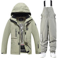 Men's and women's waterproof ski suit in blue with black trousers for winter snow sports