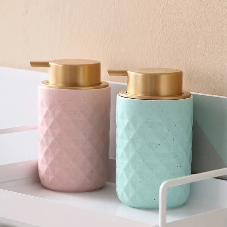 Foam pump dispenser with large head in metallic gold finish for facial cleansers and shower gels