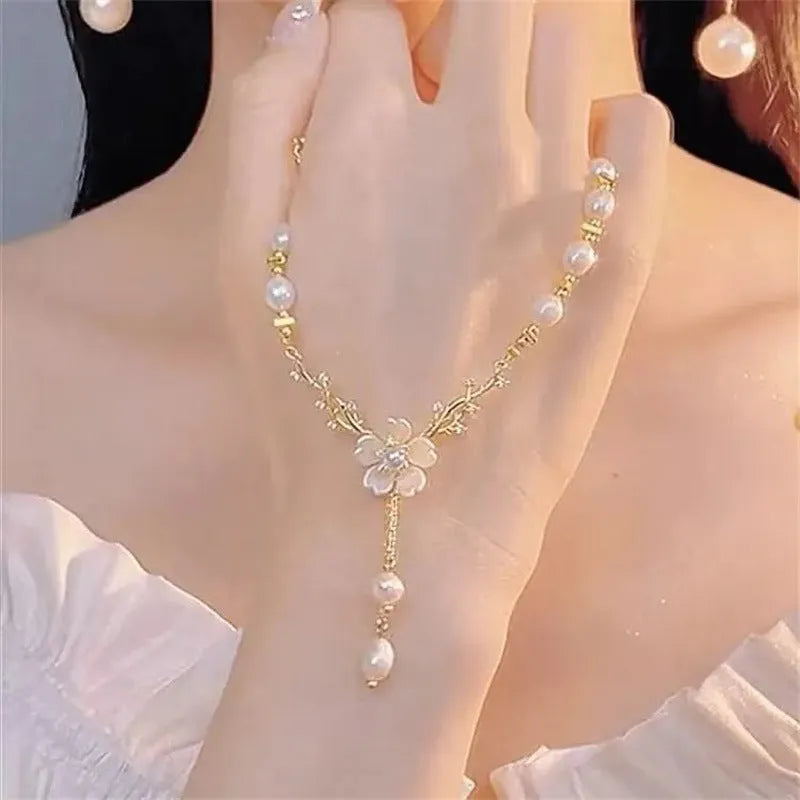 Alloy necklace with pearl chain and floral rose pendant in pearl flower colour.