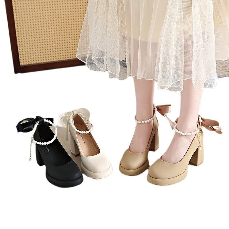 Beige women's Mary Jane shoes with chunky heel and ankle strap buckle on a white background
