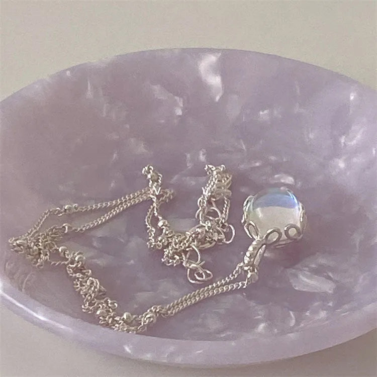Women's sterling silver geometric stone pendant necklace on a curb chain, adjustable length.