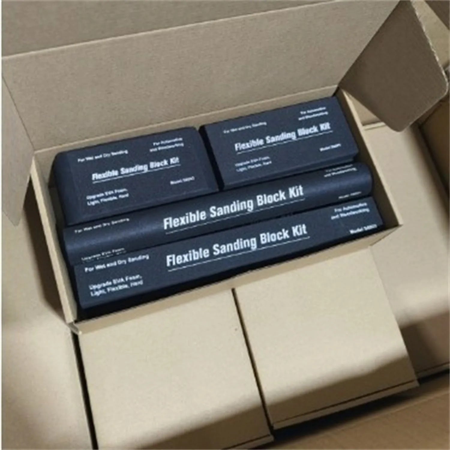 Set of seven black frosted EVA blocks with metal caps arranged together