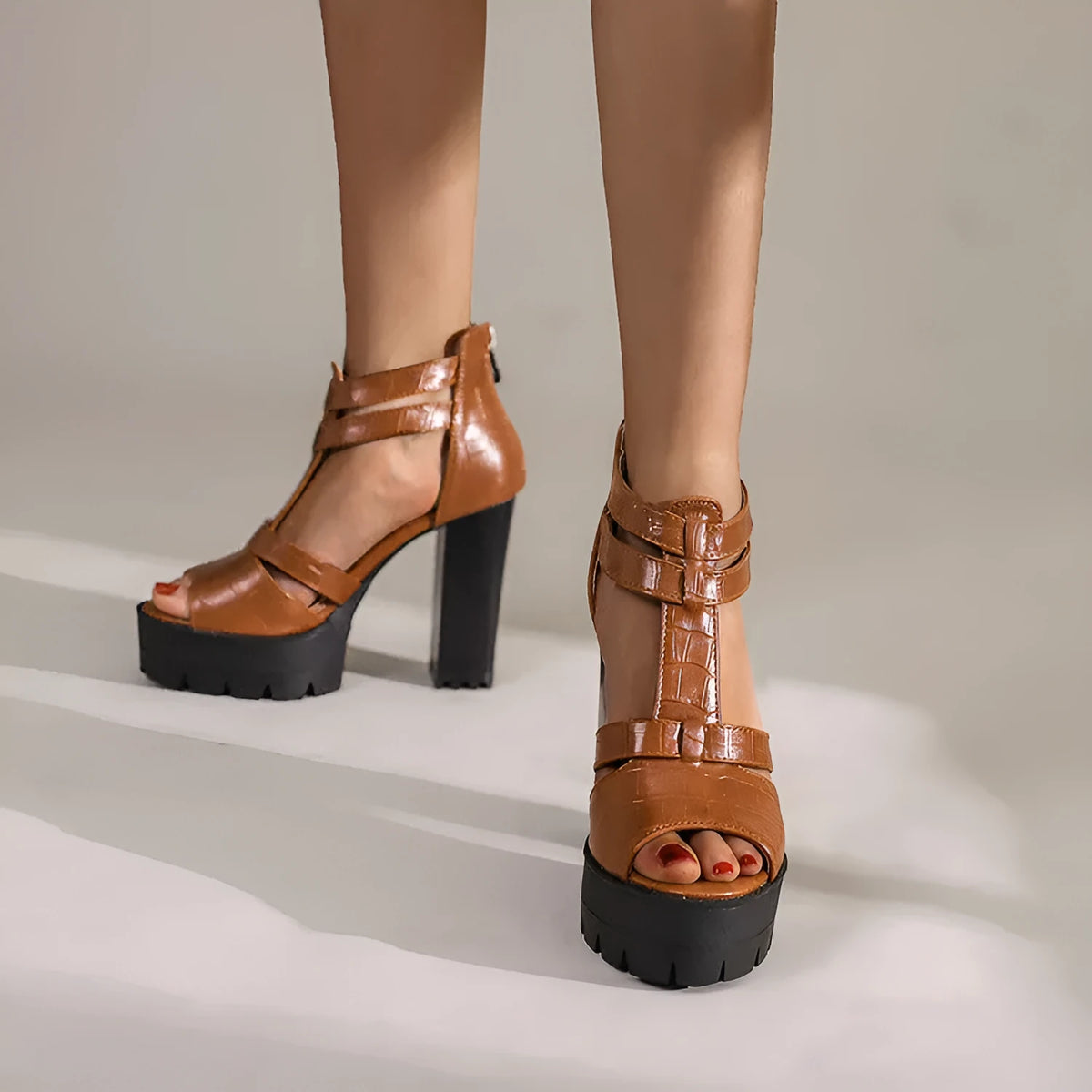 Black platform high heel sandals with round toe and back zipper closure
